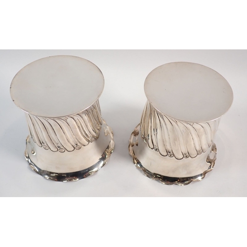 151 - A pair of silver spiral gadrooned bottle holders or coasters by Atkin Bros, Sheffield 1892/1896, 11c... 