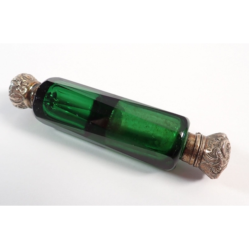 154 - A Victorian red glass double ended scent bottle and a green glass one, both with silver plated lids,... 