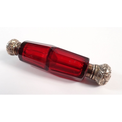 154 - A Victorian red glass double ended scent bottle and a green glass one, both with silver plated lids,... 