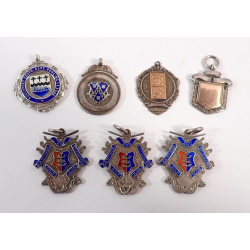 155A - Seven silver and enamel sports medals, one with gold inset of cricket interest, 82g total