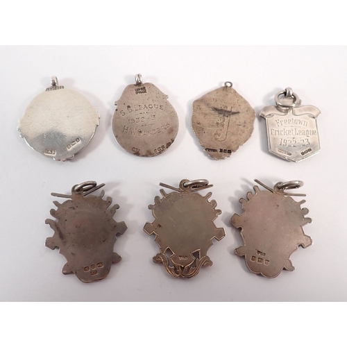 155A - Seven silver and enamel sports medals, one with gold inset of cricket interest, 82g total