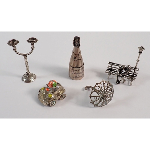159 - Five Italian silver miniatures including a Champagne Bottle, Lovers on Bench etc, total weight 75g
