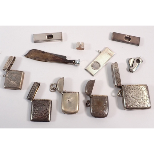 161 - A group of silver items including five vesta cases, three cigar cutters, a pipe tamper etc. weighabl... 
