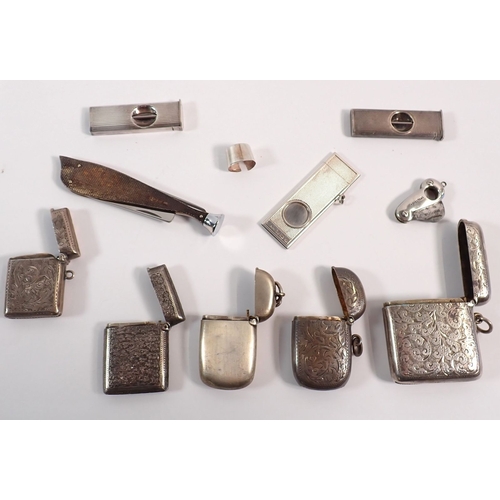 161 - A group of silver items including five vesta cases, three cigar cutters, a pipe tamper etc. weighabl... 