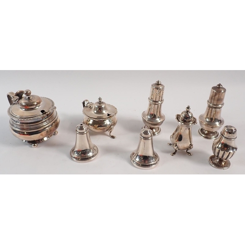 169 - Two silver pairs of pepper pots and two single pepper pots plus two mustard pots, largest 9cm tall, ... 