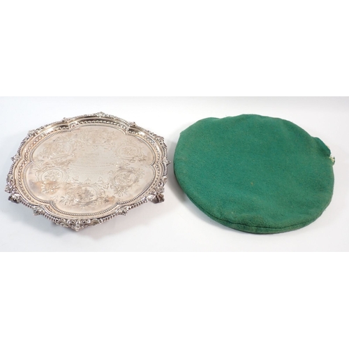 184 - A Victorian silver salver with engraved scrolling roundel decoration and foliate beaded border, cent... 