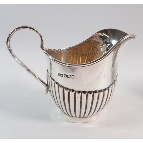 186 - A Viners silver half gadrooned sugar bowl and milk jug, Sheffield 1930, 455g
