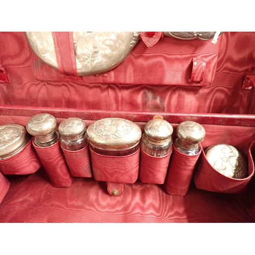 191 - A Victorian travelling toiletry case fitted eight silver and glass toiletry bottles, London 1900 by ... 