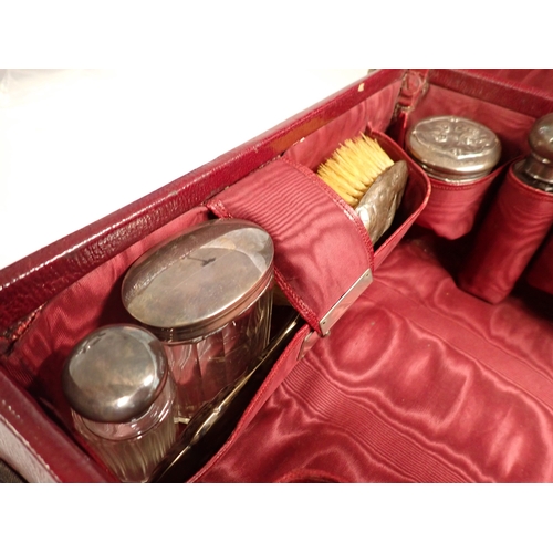 191 - A Victorian travelling toiletry case fitted eight silver and glass toiletry bottles, London 1900 by ... 