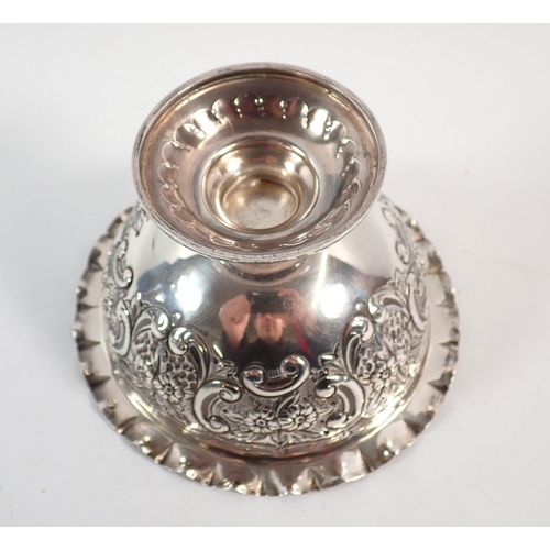 194 - A silver circular pedestal dish with gilt interior and embossed scrollwork and floral decoration, Lo... 