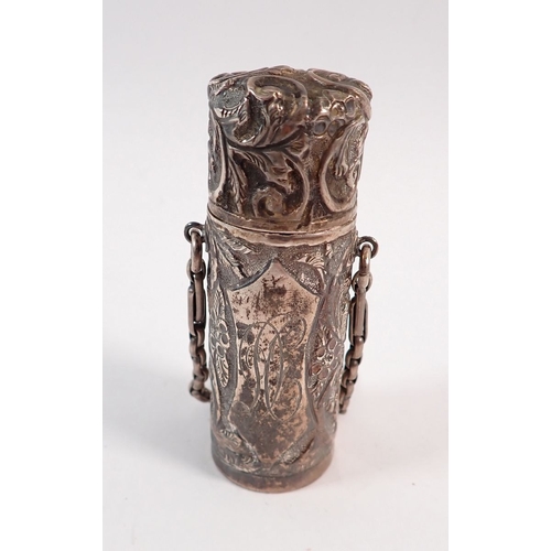 196 - A silver cased smelling salts bottle with embossed decoration by H J Cooper & Co Ltd. London 1903, 7... 