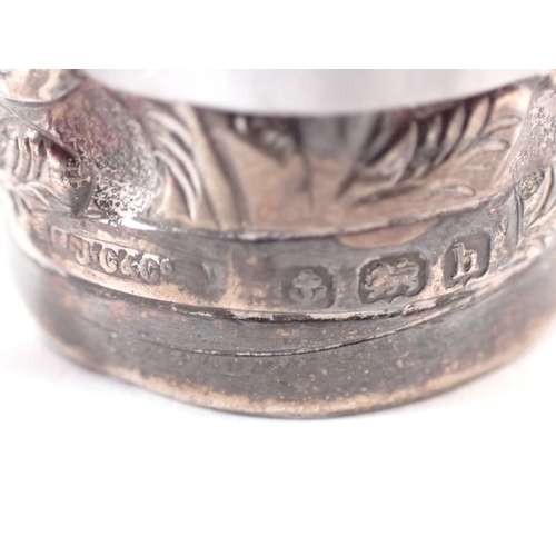 196 - A silver cased smelling salts bottle with embossed decoration by H J Cooper & Co Ltd. London 1903, 7... 