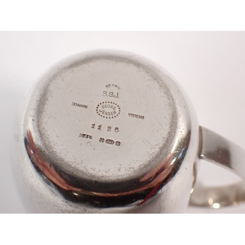 198 - A Georg Jensen silver christening mug marked 925, 6.25cm tall, 97.5g