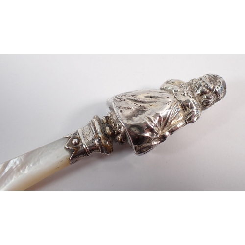 201 - A silver teether in the form of a girl, with mother of pearl handle, 10cm long by W H Collins & Co B... 