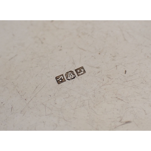 206 - A Eastern silver circular box with engraved decoration, (tested as silver) 10.5cm wide, 170g