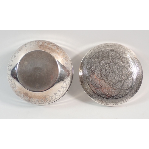 206 - A Eastern silver circular box with engraved decoration, (tested as silver) 10.5cm wide, 170g