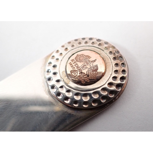 208 - A Clogau silver and gold Ryder Cup pitch repairer, 5cm long - boxed, 17g