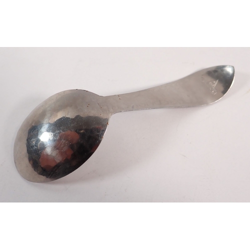 226 - A Keswick BMI pewter caddy spoon with planished finish, 11cm long