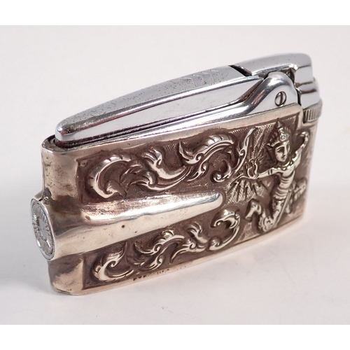 228 - A sterling silver cased Ronson lighter with Eastern dancer decoration, 6.5cm long