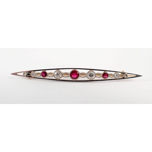 234 - An Edwardian ruby and diamond bar brooch set in open work white and yellow gold, 5.5cm long - in ori... 