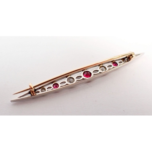 234 - An Edwardian ruby and diamond bar brooch set in open work white and yellow gold, 5.5cm long - in ori... 
