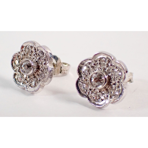 236 - A pair of 18 carat white gold and diamond floral cluster earrings, 4.6g