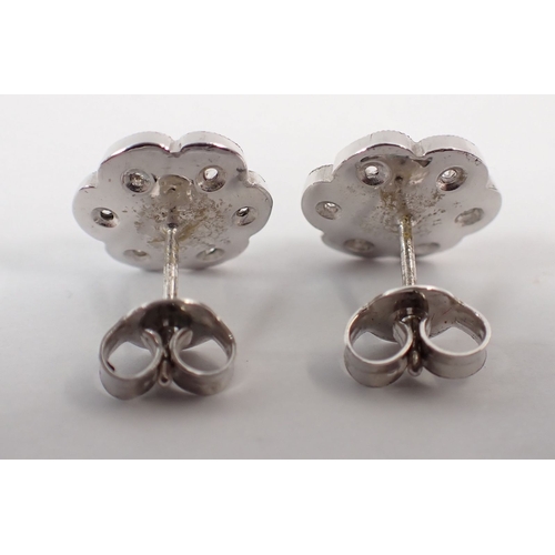 236 - A pair of 18 carat white gold and diamond floral cluster earrings, 4.6g