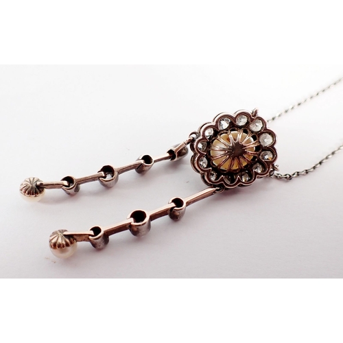 239 - An antique pearl and diamond negligee necklace with central pearl diamond cluster suspended two asym... 
