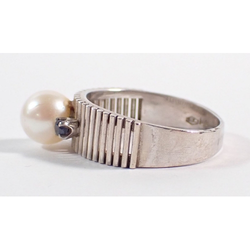 240 - A vintage 14k white gold ring set pearl flanked by two small sapphires on reeded band, size L to M, ... 
