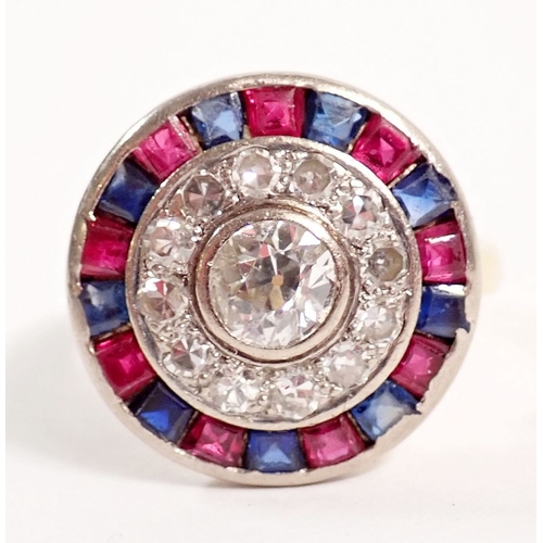 242 - An 18 carat gold, sapphire, ruby and diamond target ring, the central diamond (approx 5mm) within bo... 