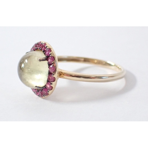 257 - An 18ct gold ring set cabochon lemon quartz with pink sapphire halo by Rosa De La Cruz, size M 2.6g