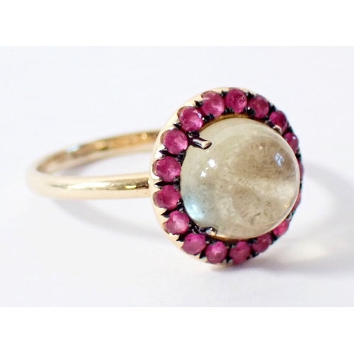 257 - An 18ct gold ring set cabochon lemon quartz with pink sapphire halo by Rosa De La Cruz, size M 2.6g