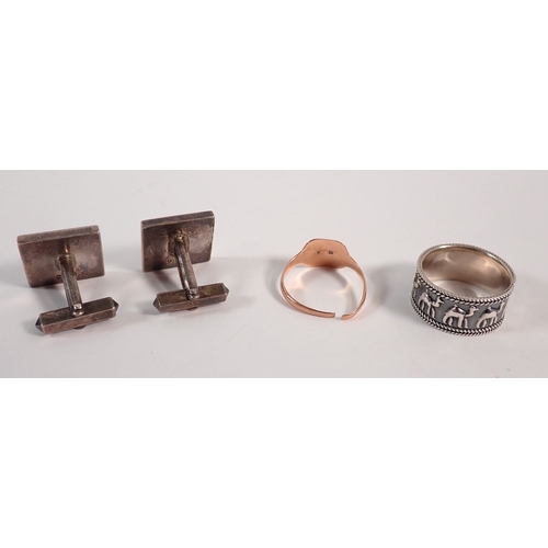281 - A pair of silver cufflinks with feature hallmark, 19g, a camel ring, 7.5g and a 9 carat gold signet ... 