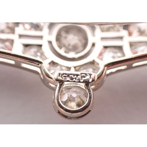 298 - An Art Deco 18 carat white gold and platinum diamond bar brooch (central diamond 4.9mm) 8cm wide - i... 
