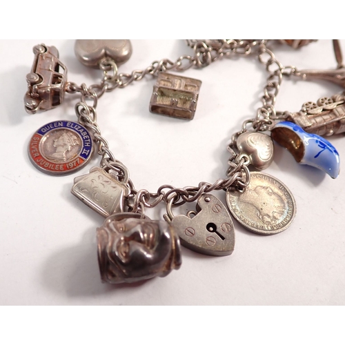 343 - A silver charm bracelet, 36g