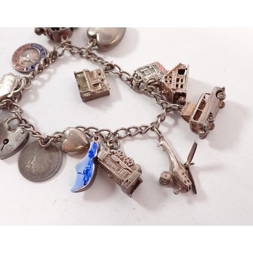 343 - A silver charm bracelet, 36g
