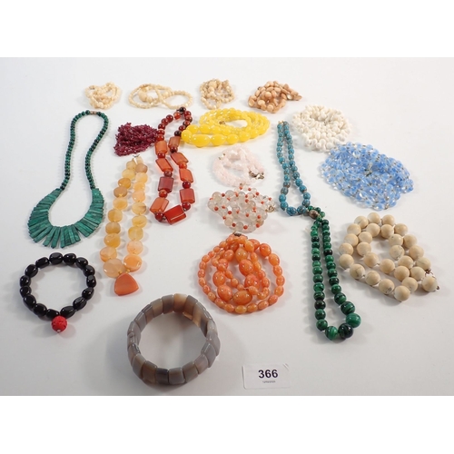 366 - A collection of stone bead necklaces and bracelets including malachite, agate, opaline etc.