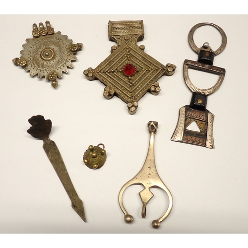 375 - Five African pendants including Tuareg white metal example