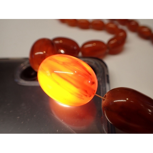 398 - Four various amber necklaces - one probably re-constituted