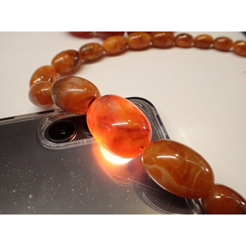 398 - Four various amber necklaces - one probably re-constituted