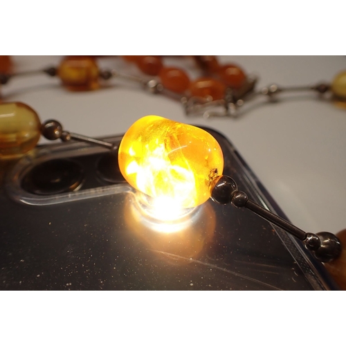 398 - Four various amber necklaces - one probably re-constituted