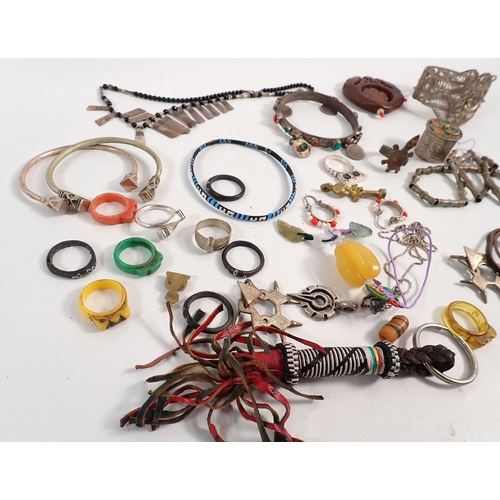 406 - A box of Indian and African jewellery including white metal etc.