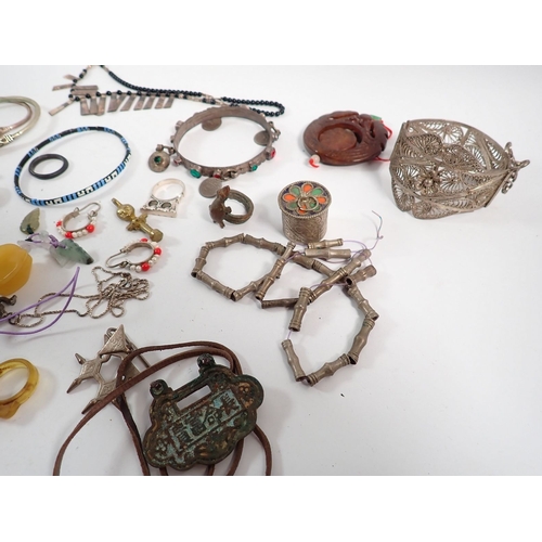 406 - A box of Indian and African jewellery including white metal etc.