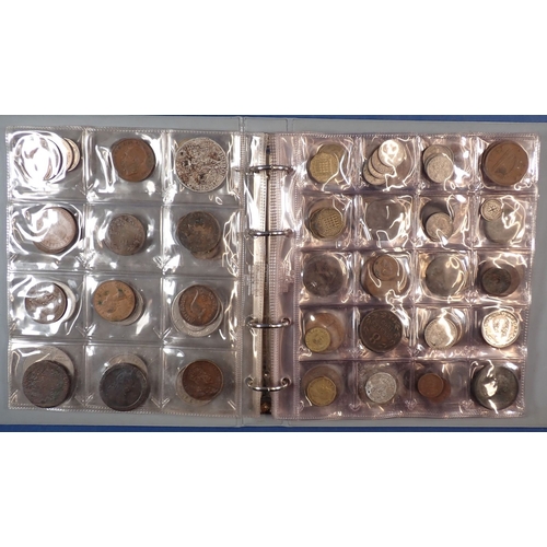 555 - A collectors coin album containing British and World coins including George III penny 1806, 1797 car... 