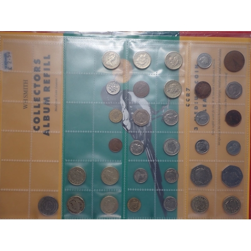 573 - A collectors album of mostly modern British coins including round pounds, two pounds, fifty pence co... 
