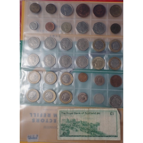 573 - A collectors album of mostly modern British coins including round pounds, two pounds, fifty pence co... 