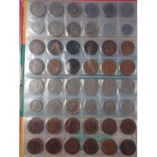 573 - A collectors album of mostly modern British coins including round pounds, two pounds, fifty pence co... 