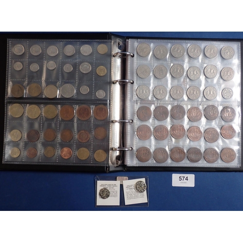 574 - An album of British and World coins including silver examples, pre 1920 shillings x3, threepences x9... 