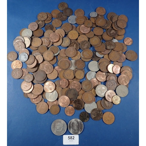 582 - A collection of pre decimal British coins across two albums plus loose, Victoria - Elizabeth II penn... 