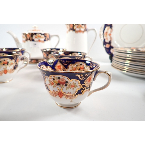 24 - A Royal Albert 1920's tea set comprising teapot with stand, coffee pot, milk jug, sugar, twelve cups... 